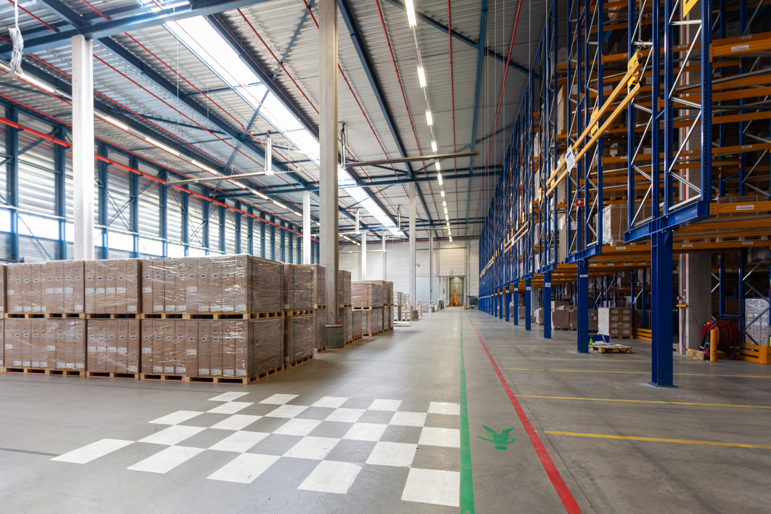 A view of full warehouse with forklift